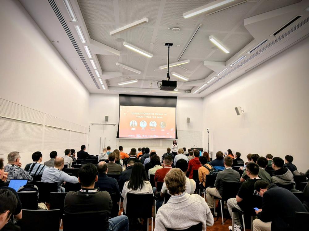 Catarina Gamboa presenting Usability-Oriented Design of Liquid Types for Java to a full room at ICSE 2023.